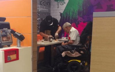McDonald’s employee helps handicapped customer eat meal in viral photo – CBS News